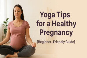 “A pregnant woman practicing yoga in a bright, peaceful room, sitting cross-legged on a mat with eyes closed and hands resting on her knees, wearing a pink top and gray leggings, symbolizing calmness and wellness during pregnancy.”