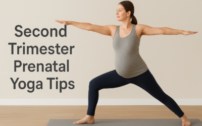 A pregnant woman in her second trimester practicing a modified Warrior II yoga pose on a mat, positioned in a bright indoor room, with the text “Second Trimester Prenatal Yoga Tips” displayed clearly on the left side.